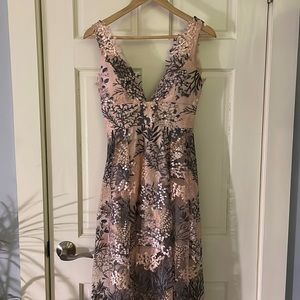 Pale pink L’ATISTE maxi dress with gold, gray/green, and pink floral appliqués